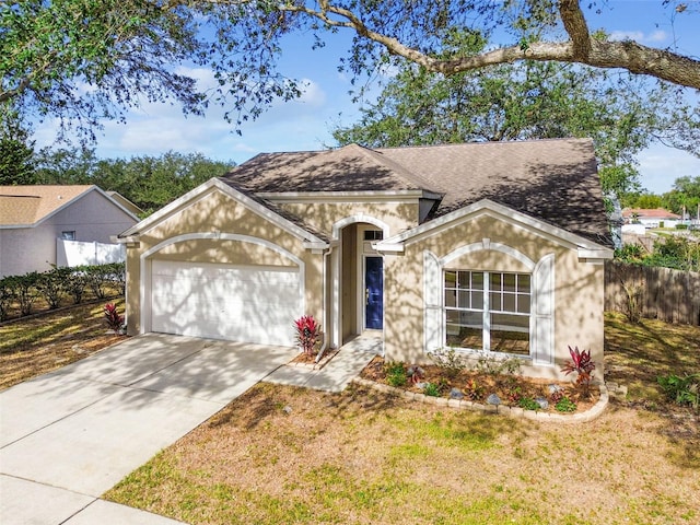 single story home with a garage and a front yard