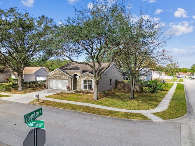 view of front of home featuring a garage and a front lawn