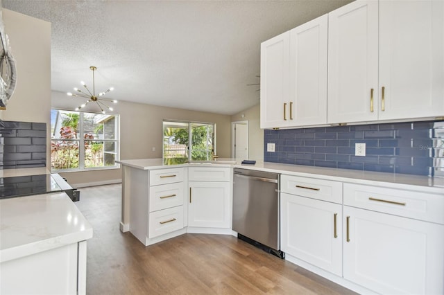 kitchen featuring kitchen peninsula, appliances with stainless steel finishes, light wood-type flooring, and white cabinetry