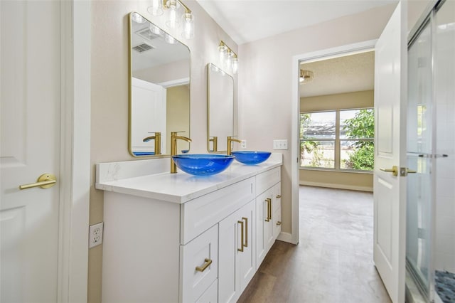 bathroom with hardwood / wood-style floors and vanity