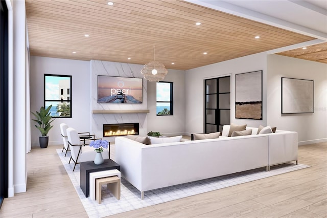 living room with light wood-type flooring, wood ceiling, and a high end fireplace