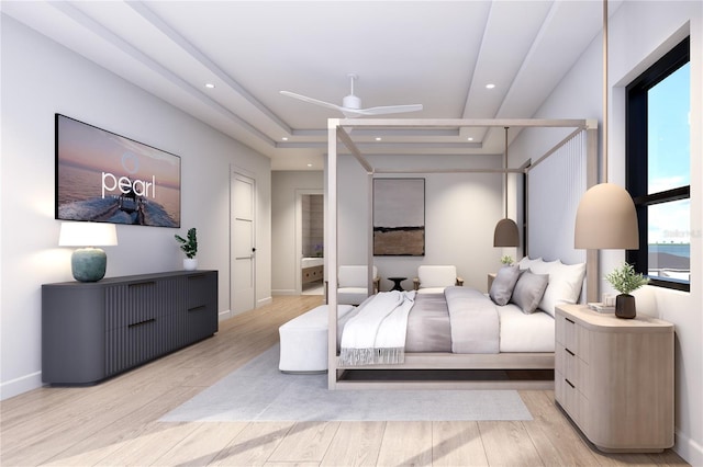 bedroom featuring light wood-type flooring, multiple windows, and ceiling fan