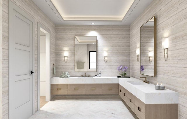 bathroom with vanity, a tray ceiling, and parquet floors