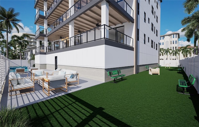 view of yard with a balcony, outdoor lounge area, and a patio area