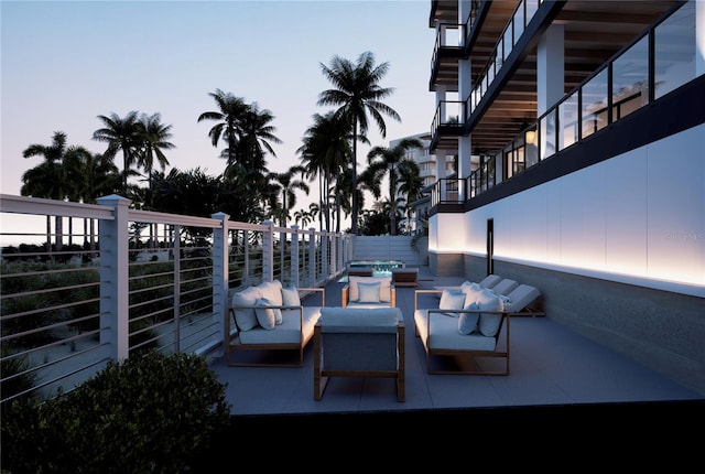 patio terrace at dusk featuring an outdoor living space with a fire pit