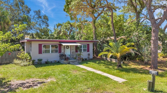 view of front of home with a front yard