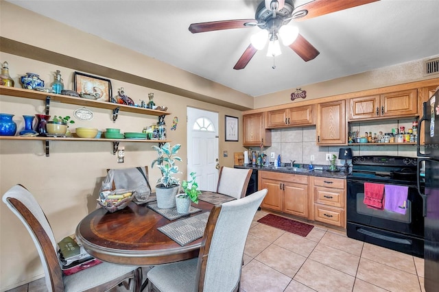 kitchen featuring light tile patterned flooring, backsplash, black electric range, ceiling fan, and sink