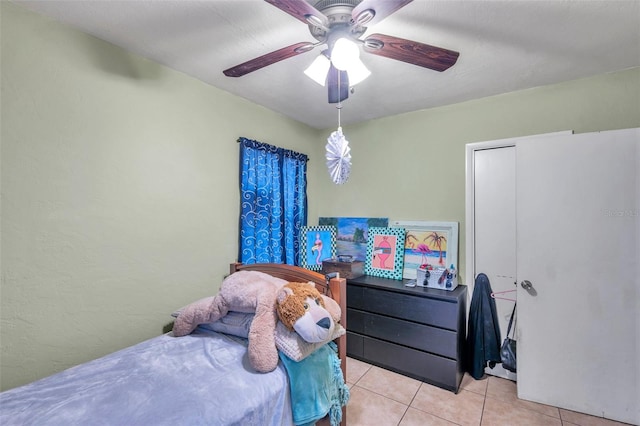 bedroom featuring ceiling fan and light tile patterned floors