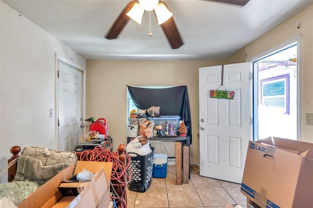 tiled entryway with ceiling fan