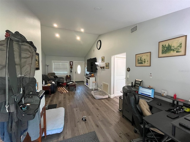 office space with vaulted ceiling and hardwood / wood-style flooring