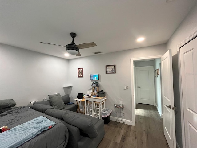 bedroom featuring ceiling fan and dark wood-type flooring