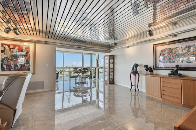 dining space featuring a water view