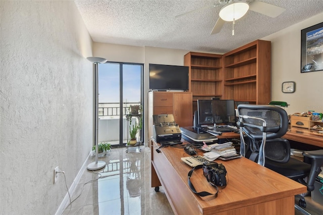 office with ceiling fan, light tile patterned floors, and a textured ceiling