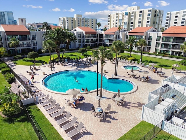 view of pool featuring a yard and a patio