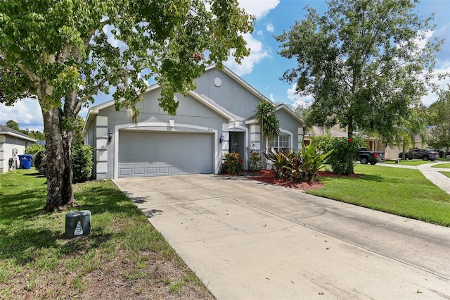 ranch-style home with a front yard and a garage