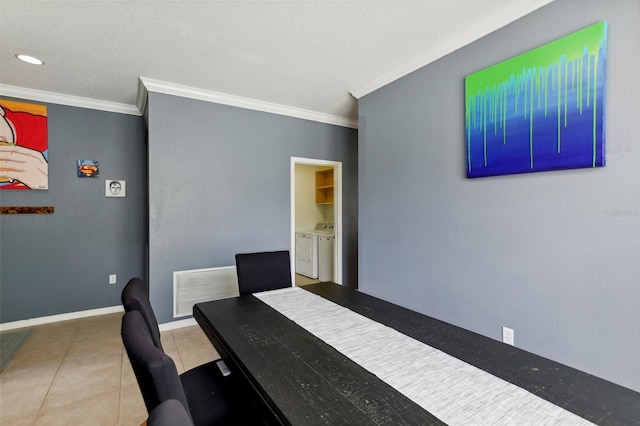 dining space featuring washer and clothes dryer, crown molding, and tile patterned floors