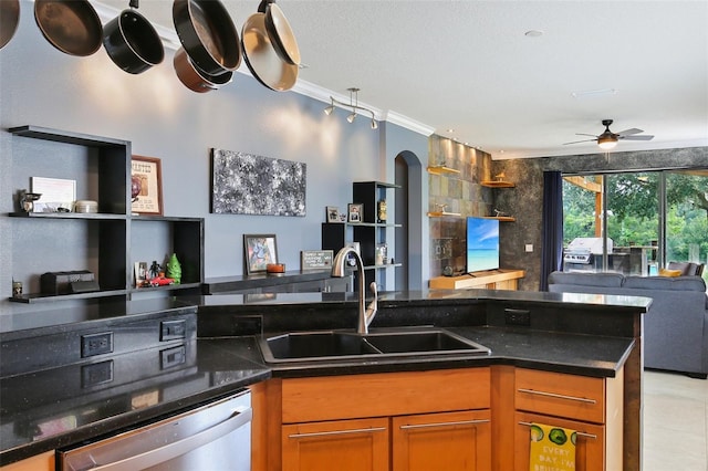 kitchen with dishwasher, a textured ceiling, sink, crown molding, and ceiling fan