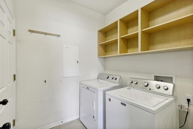 clothes washing area featuring washer and clothes dryer