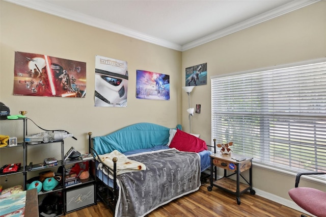 bedroom featuring dark wood-type flooring and crown molding