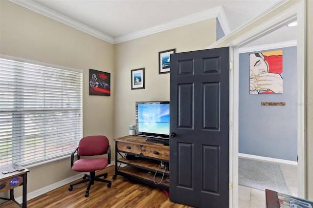 sitting room with ornamental molding and hardwood / wood-style floors