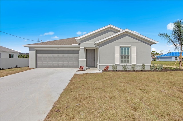 ranch-style house with a garage and a front lawn