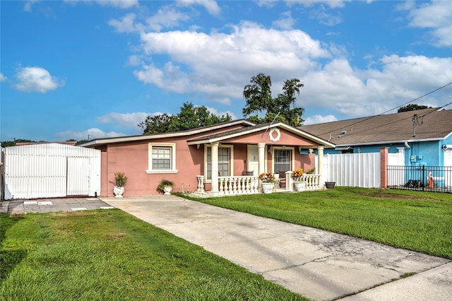 ranch-style house featuring a front lawn and a porch