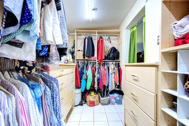 walk in closet featuring light tile patterned floors