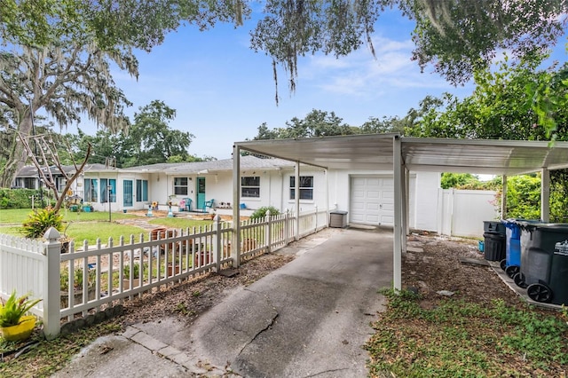 ranch-style house with a carport and a garage