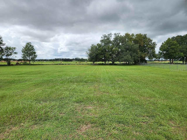 view of yard with a rural view