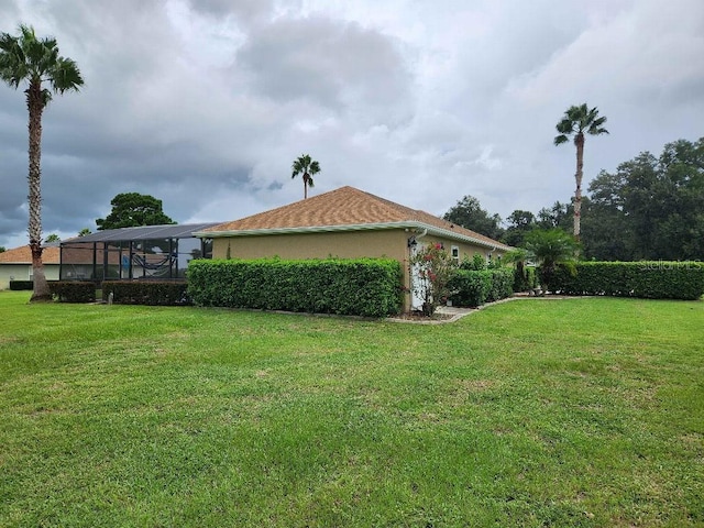 view of yard featuring a lanai