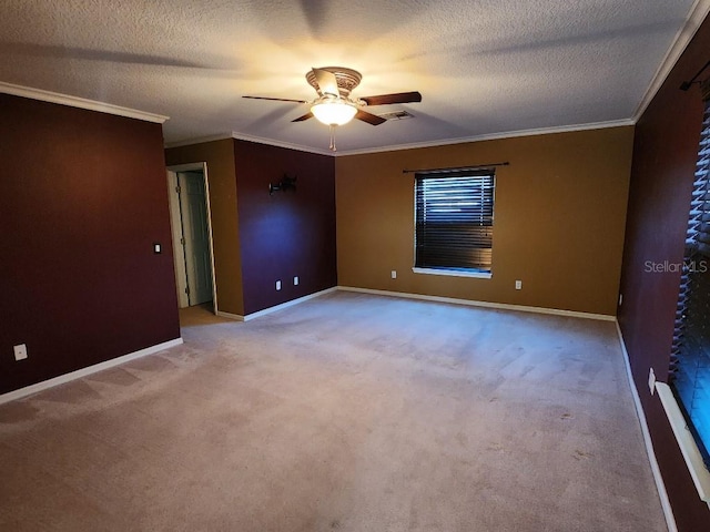 spare room with light carpet, a textured ceiling, ceiling fan, and crown molding