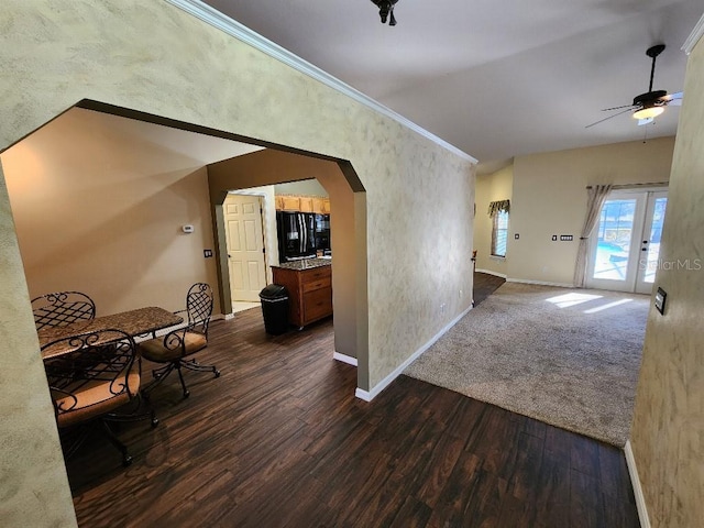 corridor featuring dark hardwood / wood-style flooring and ornamental molding