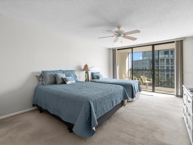 bedroom featuring light colored carpet, ceiling fan, a wall of windows, access to outside, and baseboards