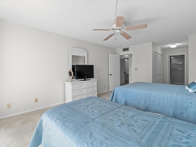 bedroom featuring baseboards, visible vents, light colored carpet, ceiling fan, and a textured ceiling