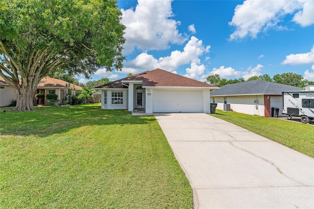 single story home featuring a garage, a front lawn, and central air condition unit