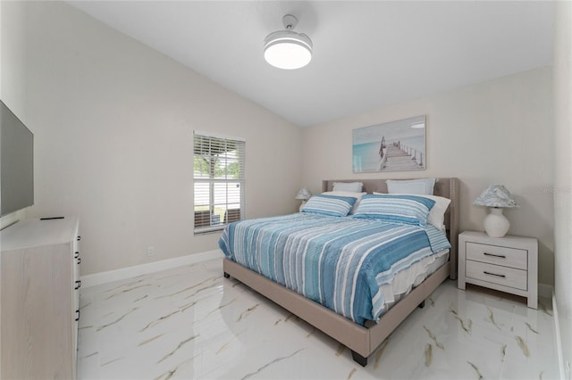 bedroom with lofted ceiling