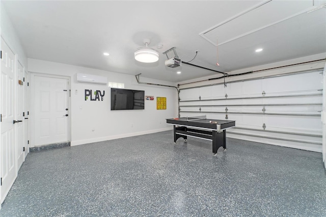 garage featuring a garage door opener and a wall unit AC