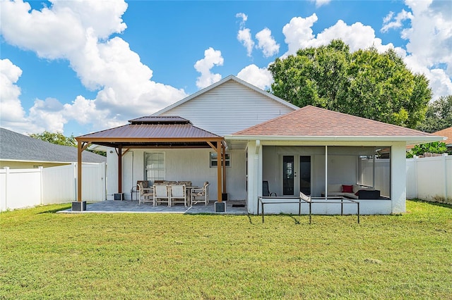 back of property featuring a gazebo, a yard, and a patio area