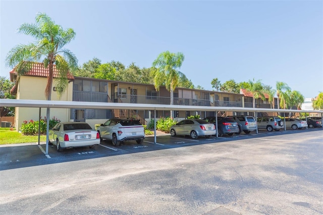 view of parking / parking lot featuring a carport