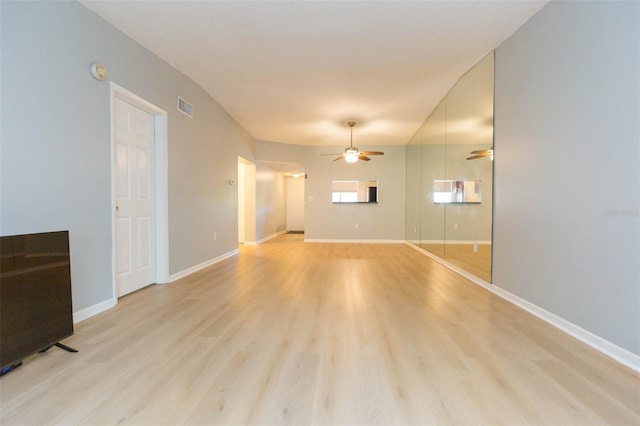 unfurnished living room with ceiling fan and light wood-type flooring