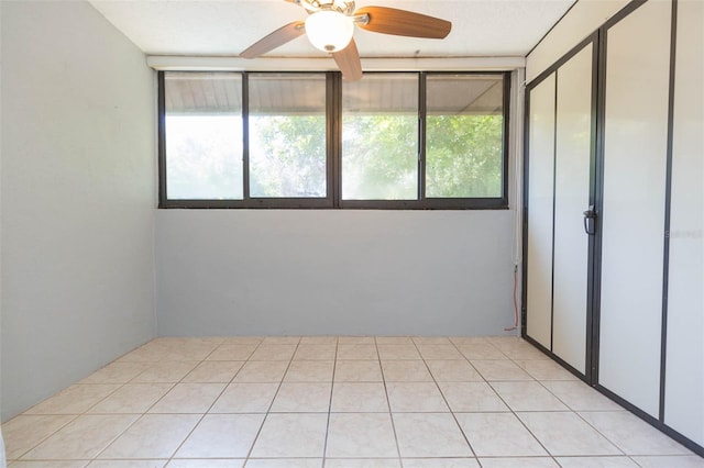 unfurnished room with a ceiling fan