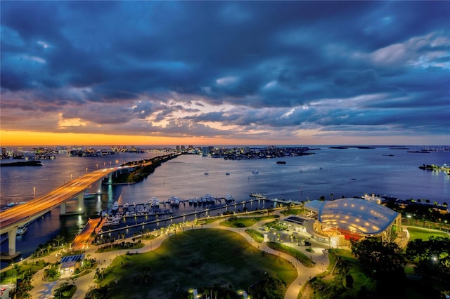 aerial view at dusk with a water view