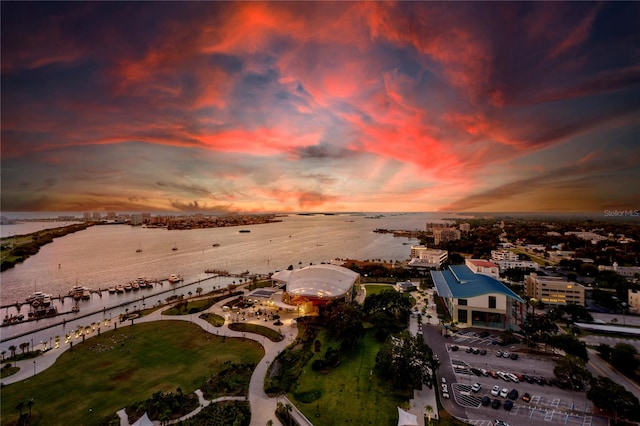 aerial view at dusk with a water view