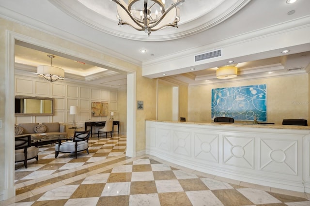 corridor with a tray ceiling and ornamental molding