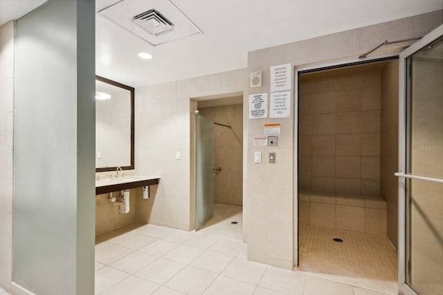 bathroom with tile walls, a tile shower, and elevator