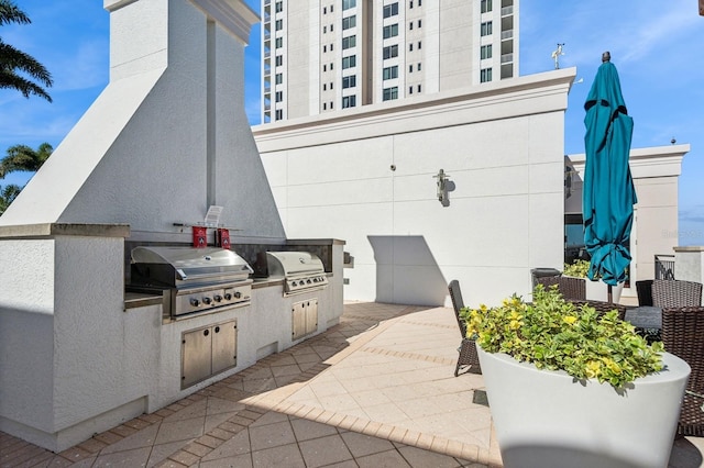 view of patio with grilling area and an outdoor kitchen