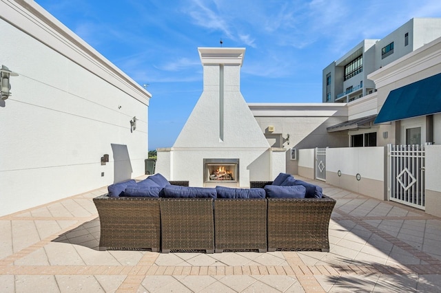 view of patio / terrace with exterior fireplace