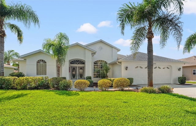 ranch-style house with a front yard and a garage