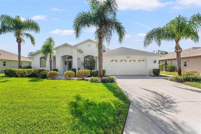 view of front facade featuring a garage and a front yard