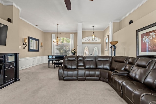 carpeted living room featuring ceiling fan with notable chandelier and ornamental molding